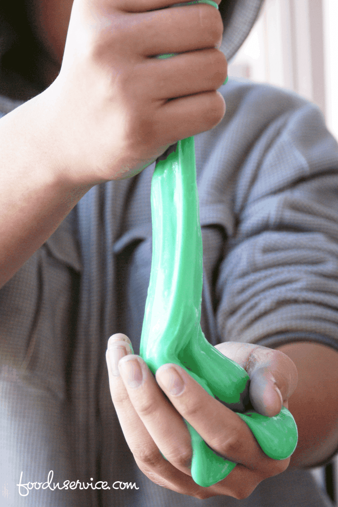 The easiest DIY green slime with glue to make! A fabulous sensory project to make with the kids. 