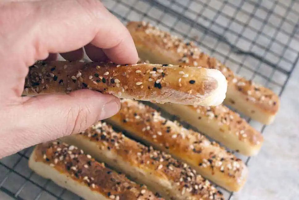 2 ingredient weight watchers bagels stick in hand and on wire rack