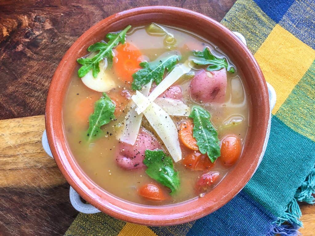 Delicious instant pot vegetable soup in a terra cotta bowl