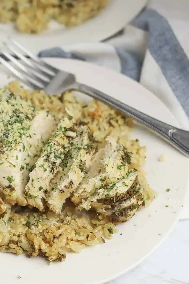 sliced chicken on plate of rice cooked in Instant pot