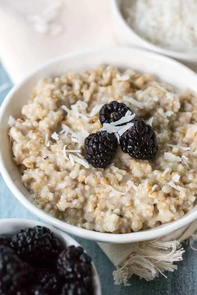 close up view of steel cut oats and blackberries made in the instant pot