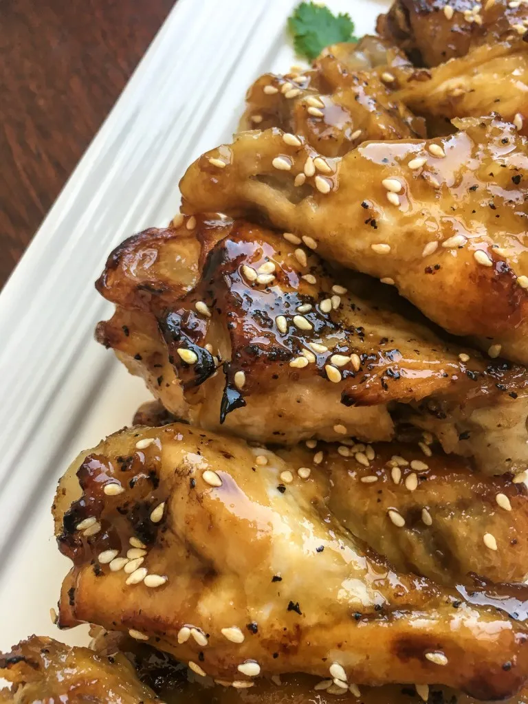 instant pot sesame garlic wings with sesame seeds on top.