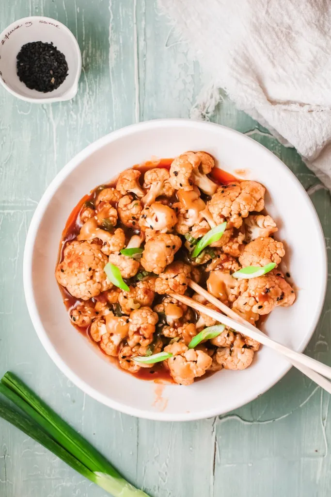 instant pot korean cauliflower recipe in a  white bowl
