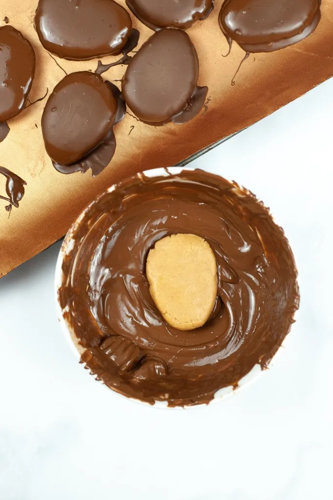 peanut butter egg made in the instant pot in melted chocolate
