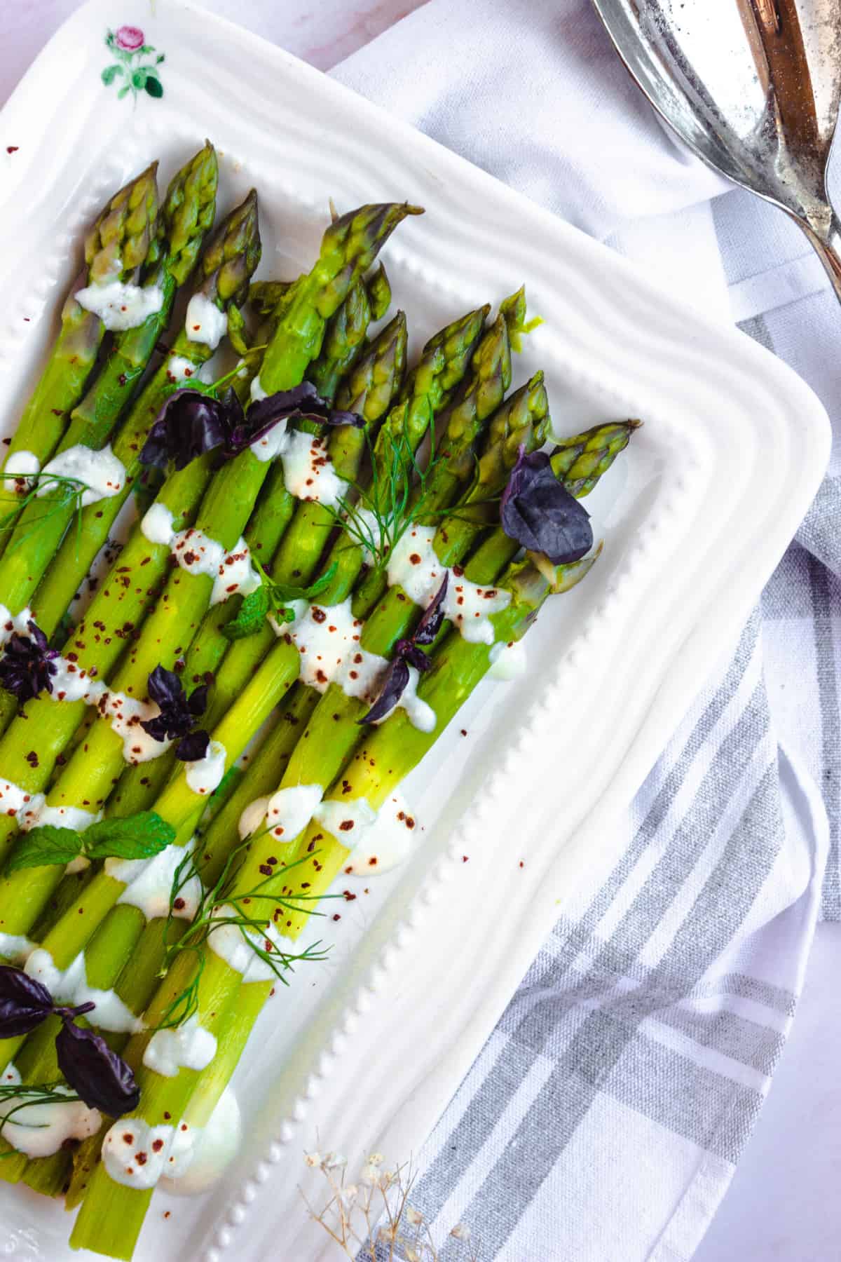 instant pot asparagus salad on a white plate with napkin