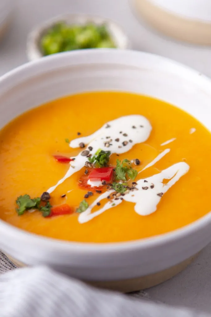 Close up view of the butternut squash soup with garnishments