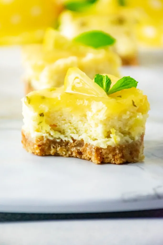 minty fresh lemon cheesecake bars on a vanilla wafer crust