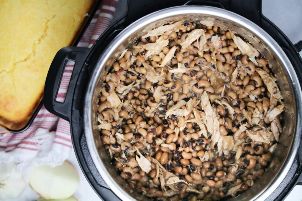 overhead shot of pressure cooked black eyed peas and cornbread