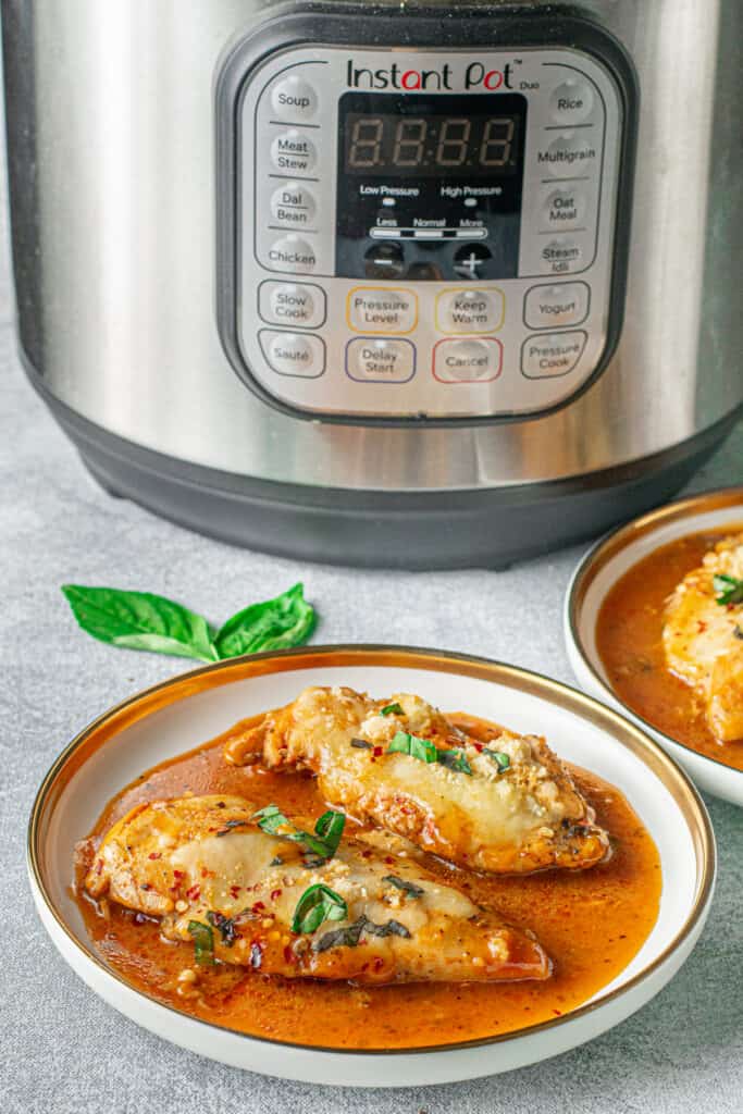 photo of an instant pot with chicken parmesan made in it