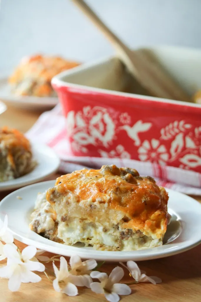 sausage gravy with biscuits topped with cheese