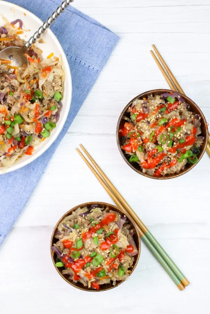 instant pot egg roll in a bowl with sriracha drizzled on top