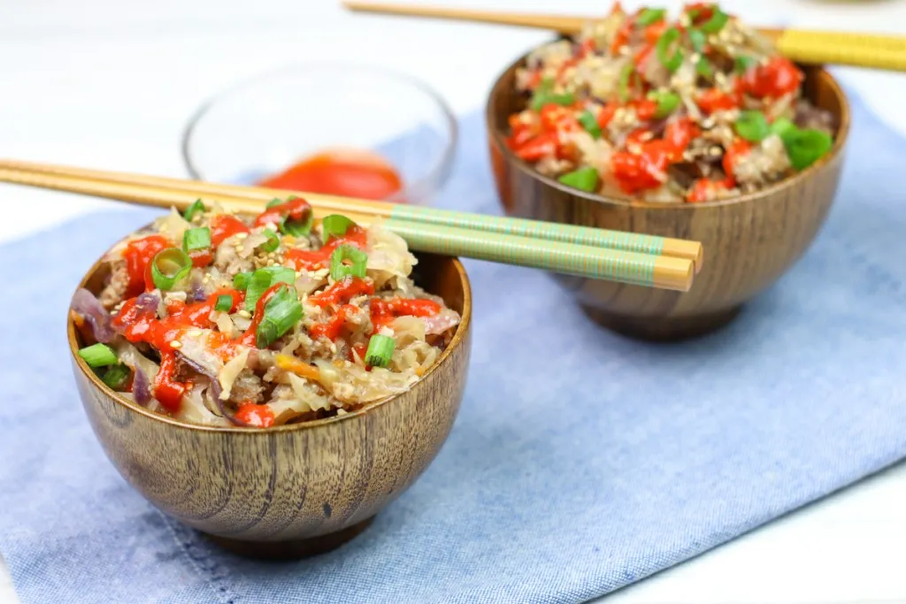 egg roll in a bowl with chopsticks