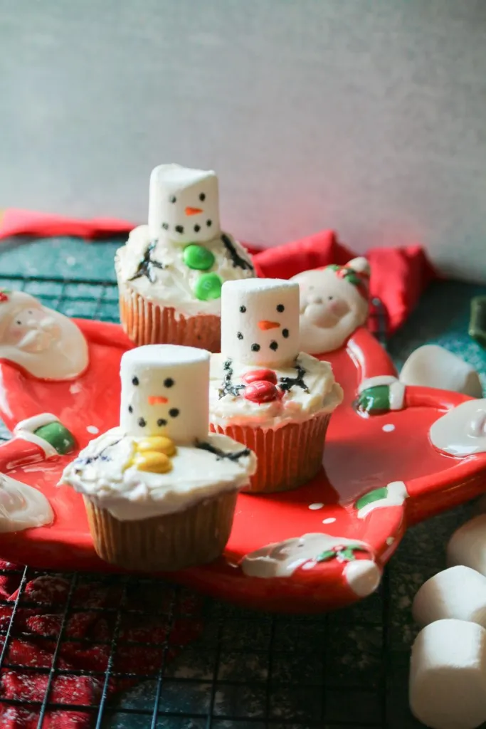 snowman cupcakes on a red star santa plate