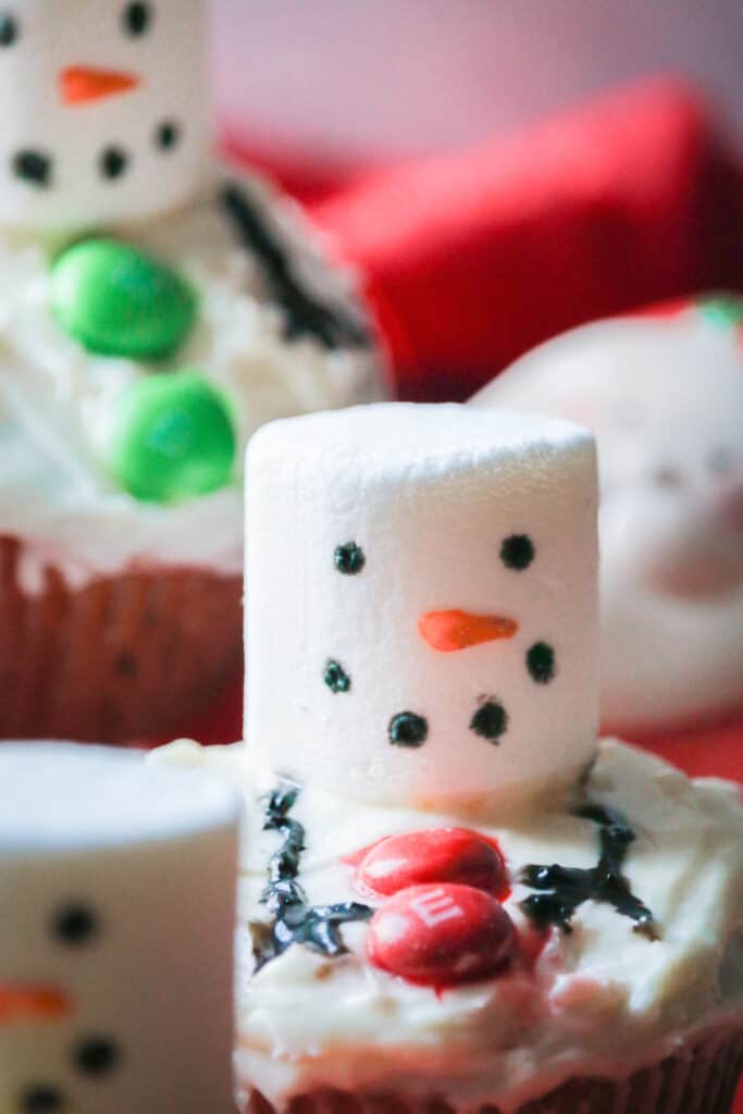 close up shot of melting snowmen cupcakes