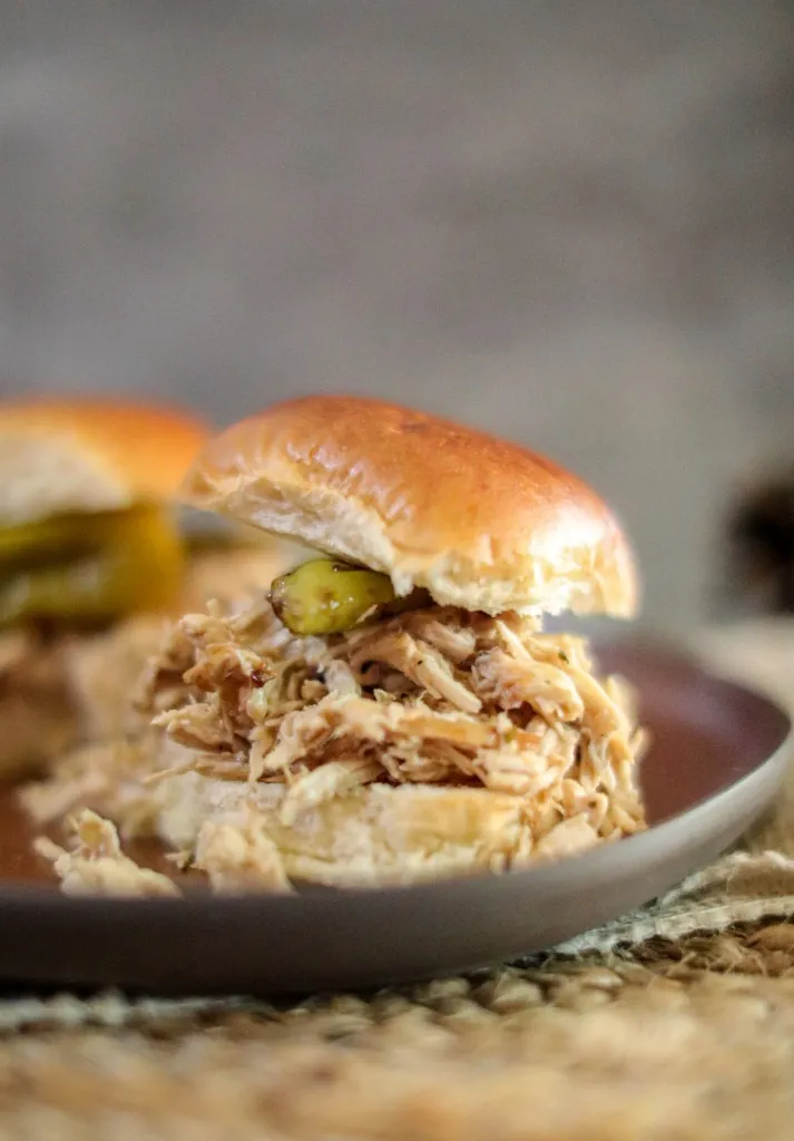 mississippi chicken sliders on a brown plate