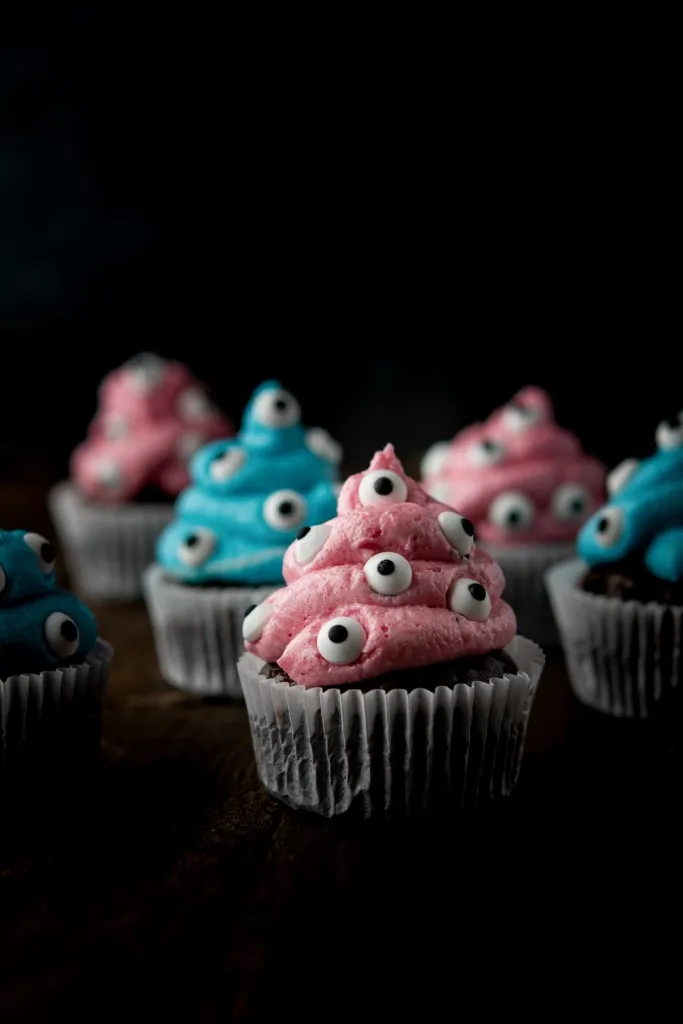 pink and blue colored monster cupcakes for halloween