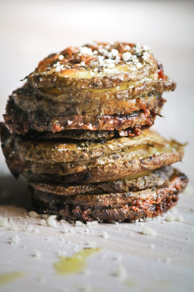 side view shot of crispy potatoes in a stack