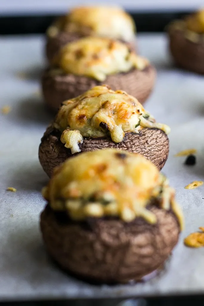 easy baked spinach mushrooms appetizer in a row close up shot