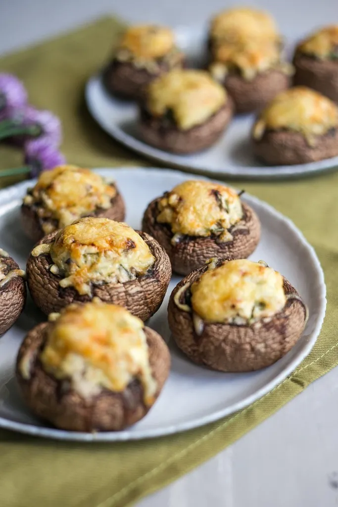 spinach stuffed mushrooms party appetizer on green napkin