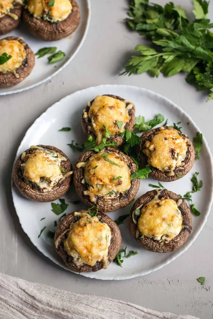 spinach stuffed mushrooms appetizers on a white plate