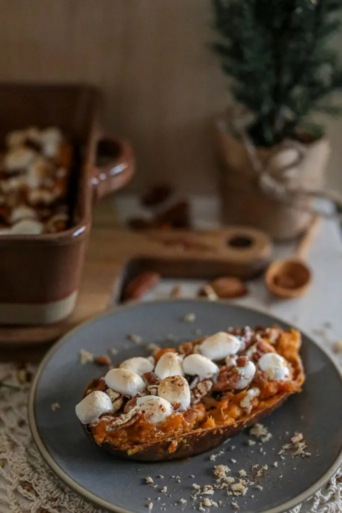 Side view of twice baked sweet potato on a grey plate