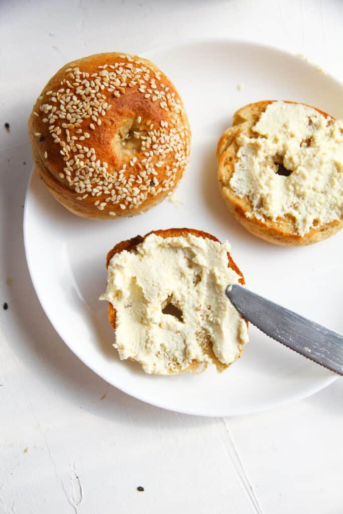 bagels with vegan cream cheese spread on it