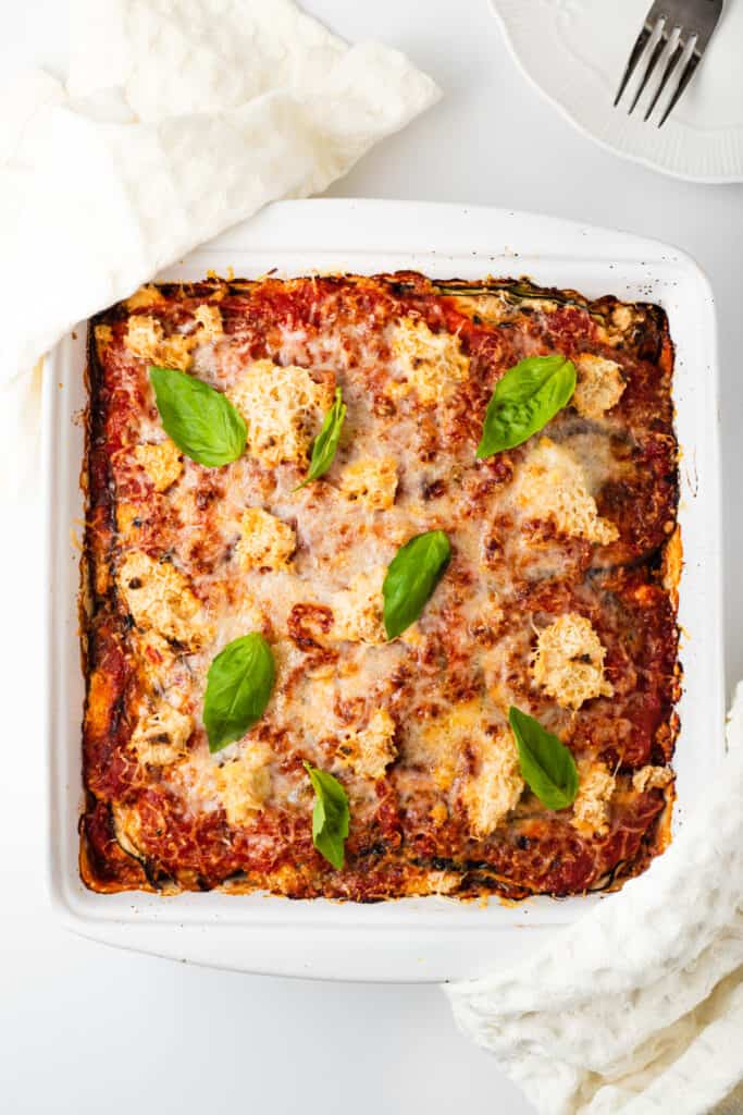 fresh made vegan lasagna in a white baking dish