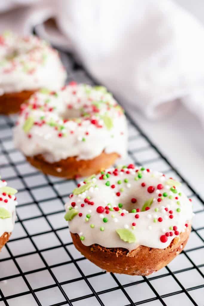 easy baked christmas doughnuts on a cooling rack