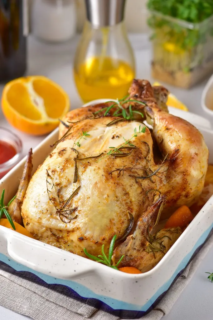 dutch oven orange roasted chicken with fresh oranges