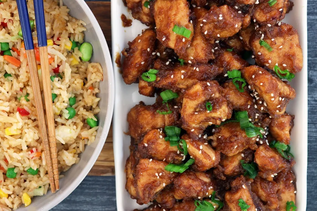 overhead shot of general tso's chicken and vegetable fried rice