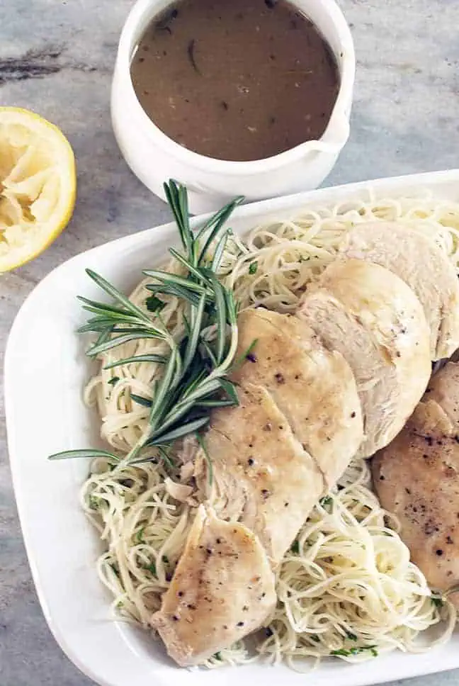 fresh rosemary over angel hair pasta with sliced chicken