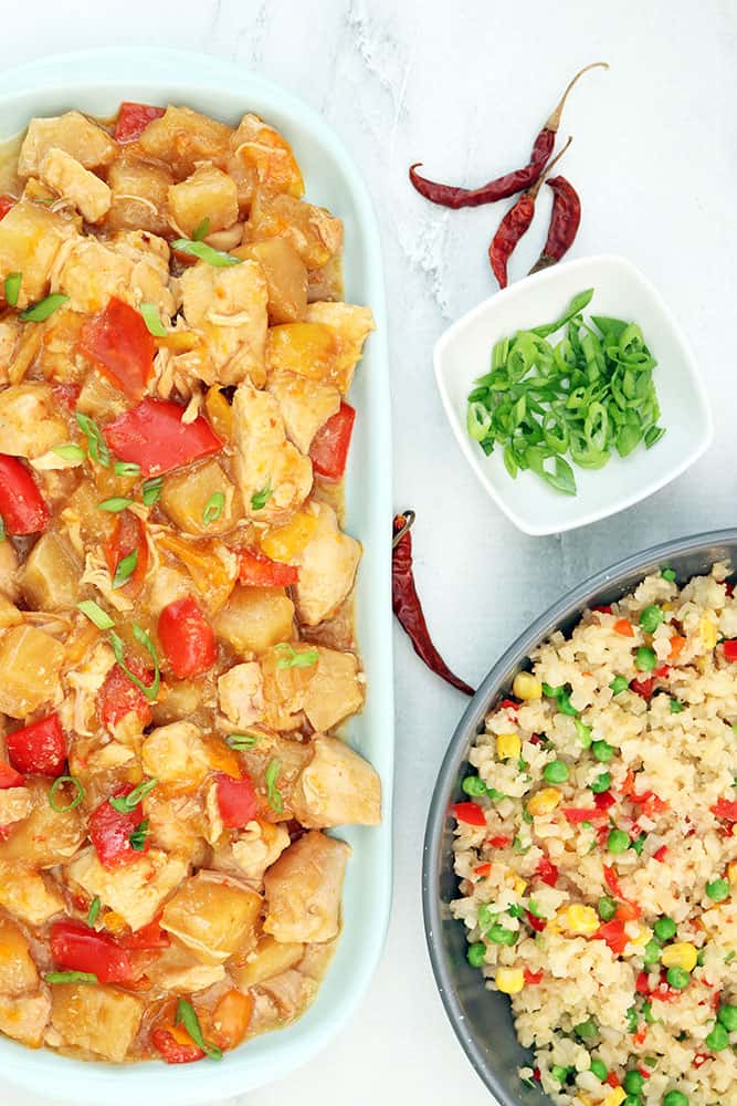 photo of pineapple chicken with chunks of red bell peppers and pineapples