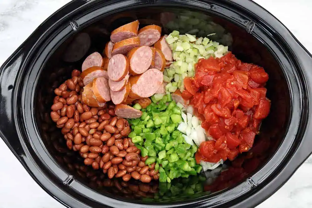 all ingredients for red beans and rice in a slow cooker