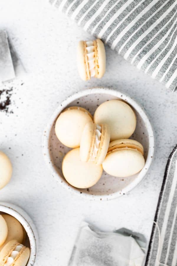 overhead shot of early grey macarons on a stone background