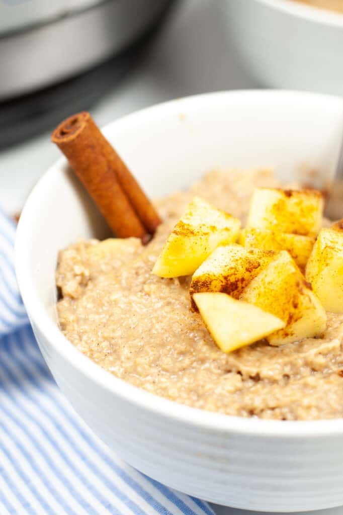 side view of easy to make Instant Pot apple cinnamon oatmeal with fresh diced apples