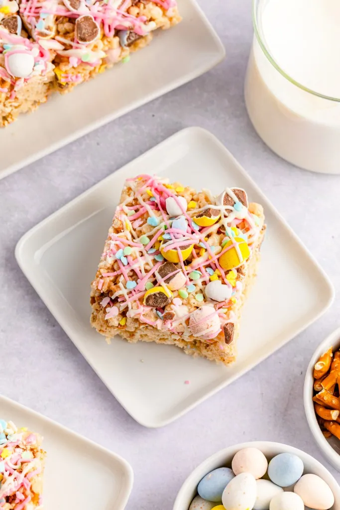Cadbury Mini Egg Rice Krispies Treats squares on small white plates