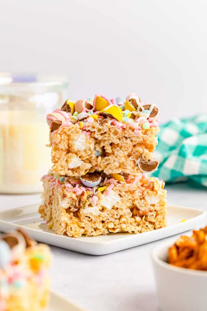 stacked Cadbury Mini Egg Rice Krispies Treats  on a small square white plate