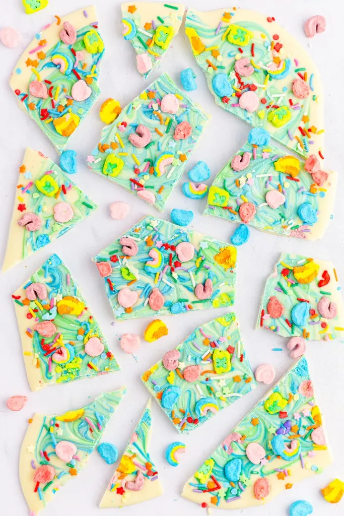 overhead view of broken pieces of rainbow lucky charms bark made with white chocolate