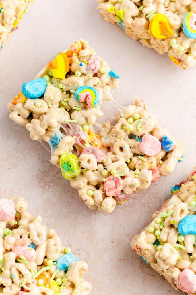 overhead shot of lucky charms treats bar being pulled apart with marshmallow strings