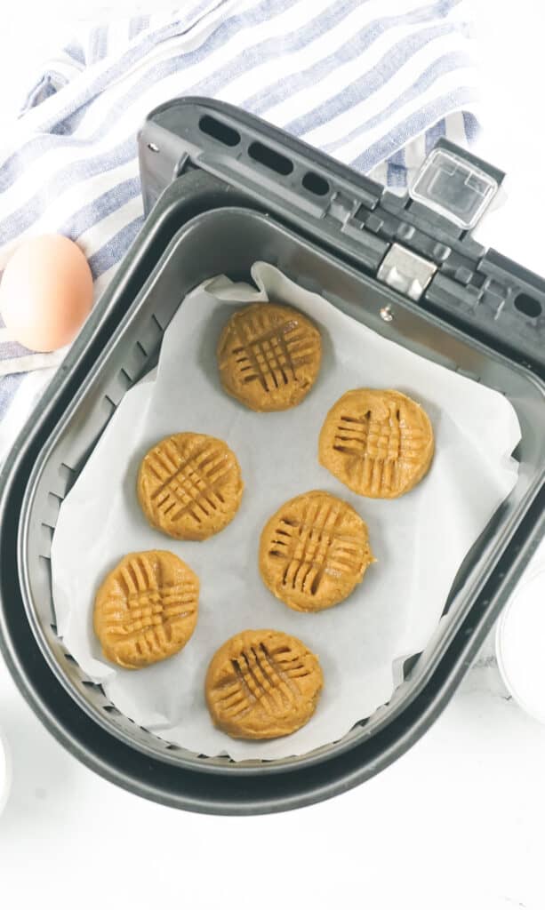 peanut butter cookie dough in an air fryer basket