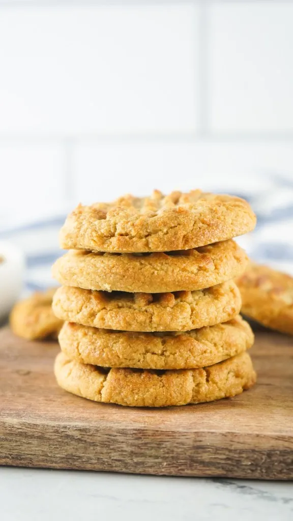 stacked air fryer peanut butter cookies on a wooden board