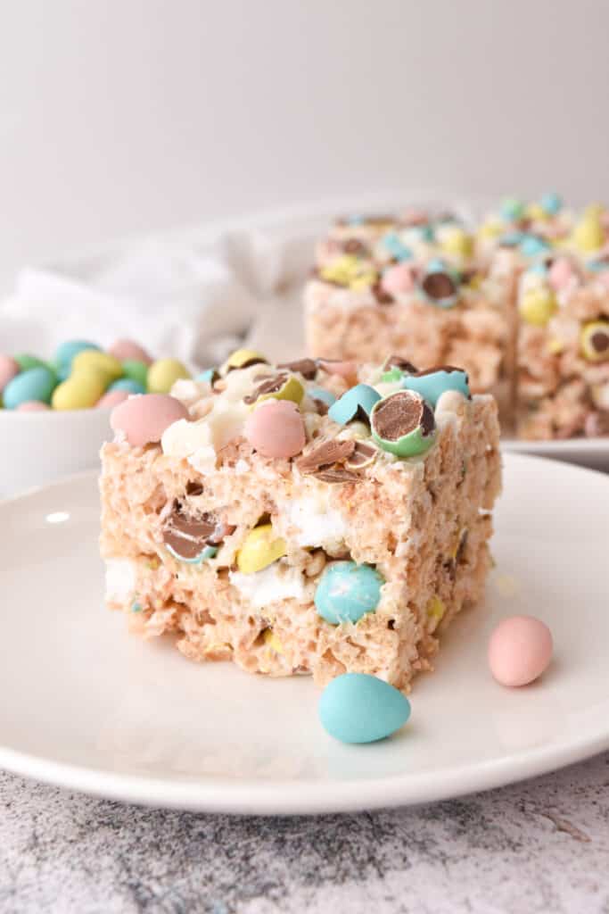 side view of Rice Krispie Easter Treats will definitely add to the fun and festivities of Easter with delicious crunchy rice Krispie cereal that’s coated in melted butter, gooey marshmallows, and chopped mini chocolate eggs.