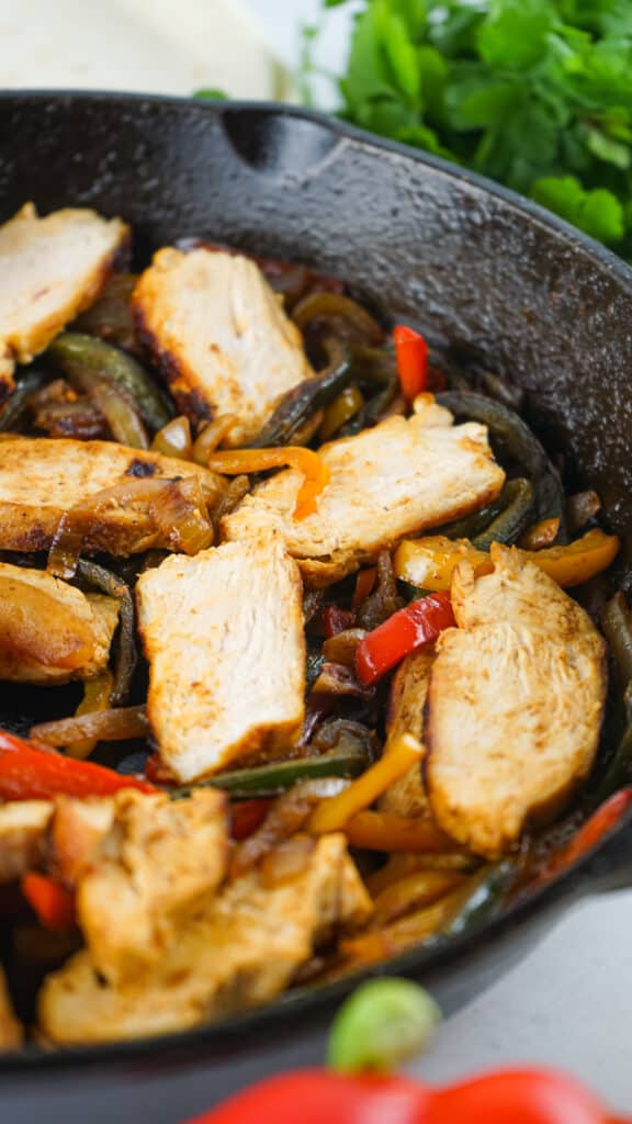 One pan chicken fajitas recipe that was created in a cast iron skillet.
