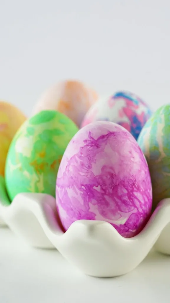photo of beautiful dyed multicolored easter eggs using bleeding tissue paper