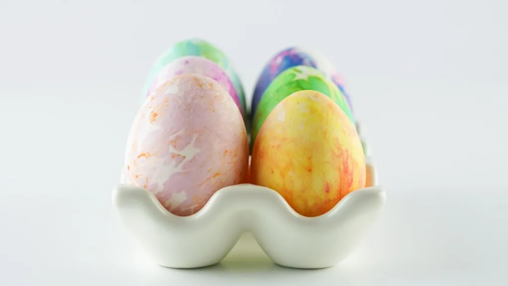 ceramic egg tray with tissue dyed eggs of different colors