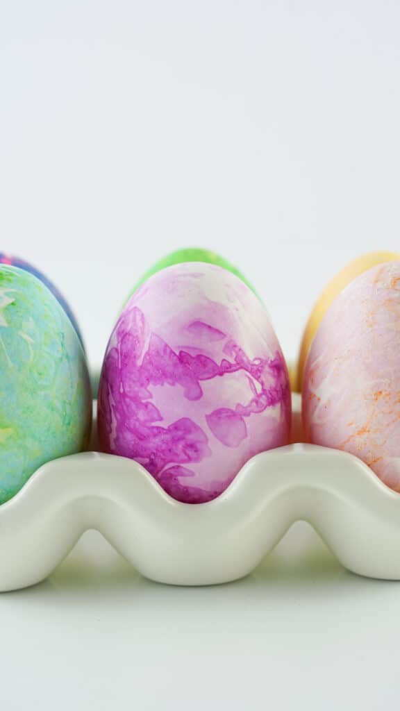 Multicolored easter eggs dyed with a marble effect using bleeding tissue paper