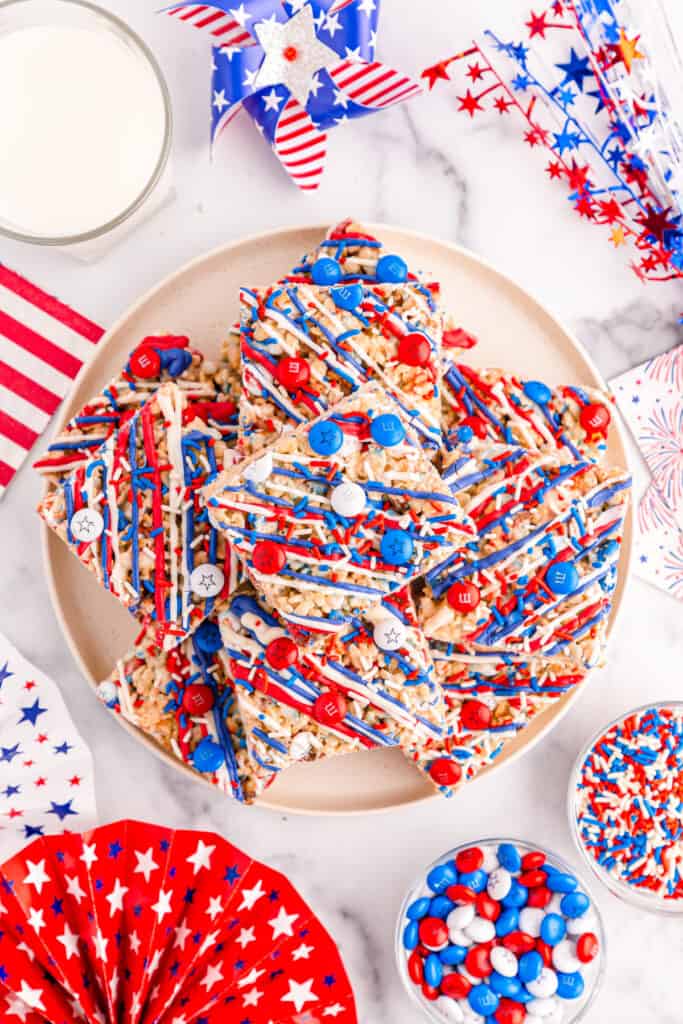 overhead shot of stacked 4th of July rice krispie treats on a tan plate