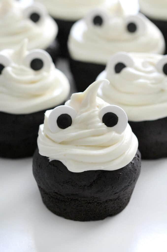 ghost cupcakes on black cupcakes