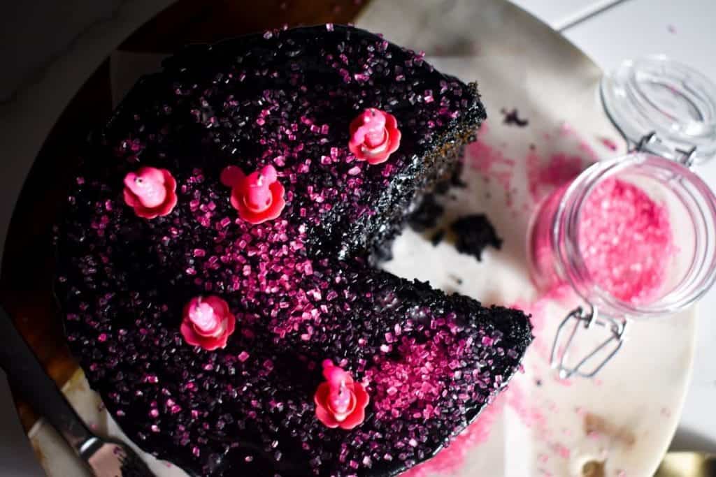 black chocolate cake with pink sugar crystals