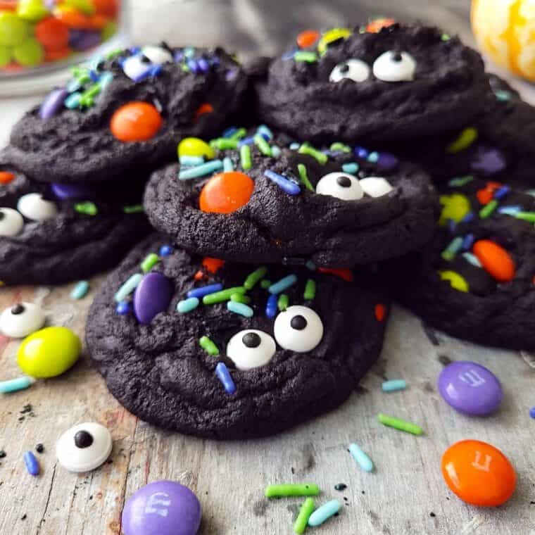 chocolate halloween cookies with eyes and multi colored sprinkles